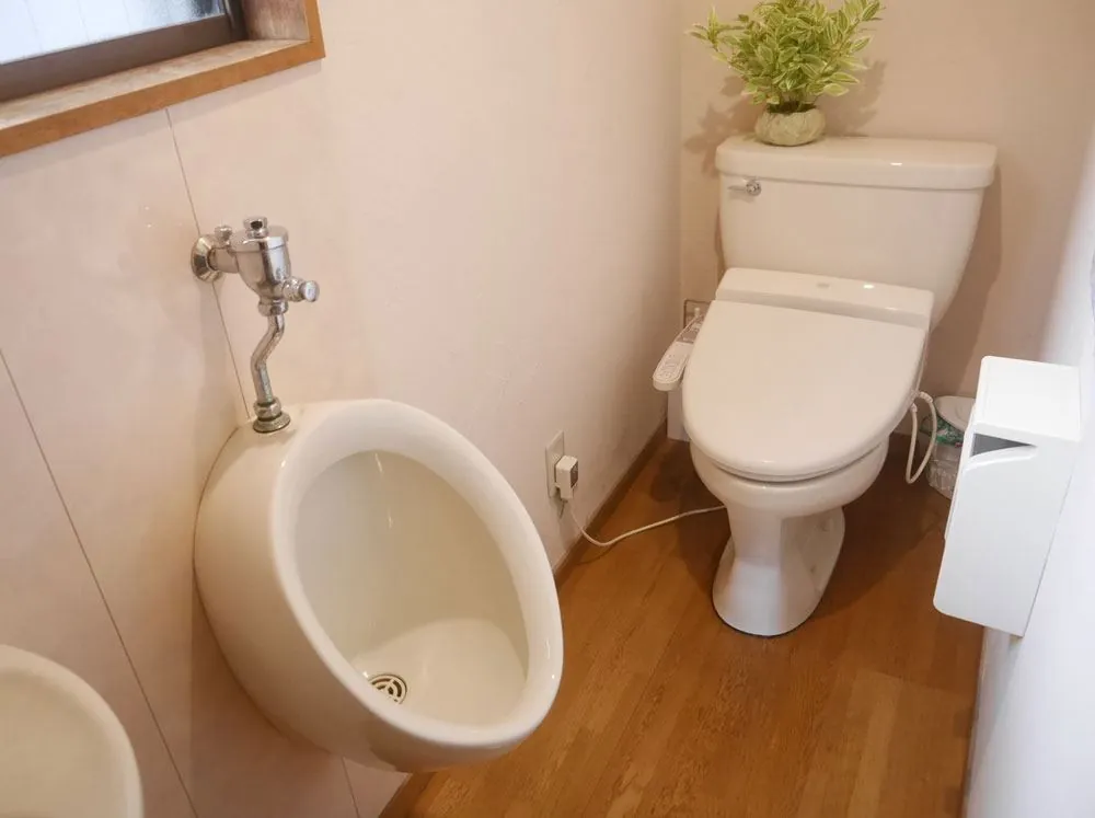 Clean toilet with a heated washlet seat at Rozan