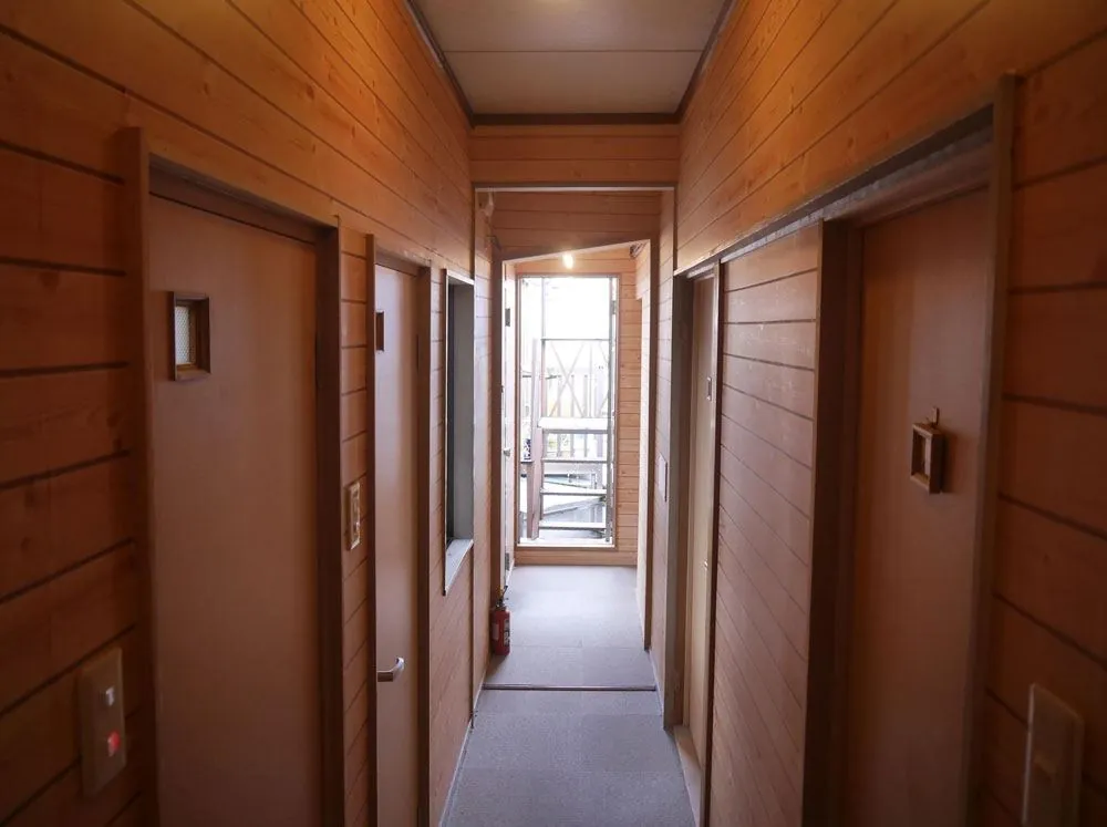 Wood-panelled hallway leading to the private rooms at Rozan